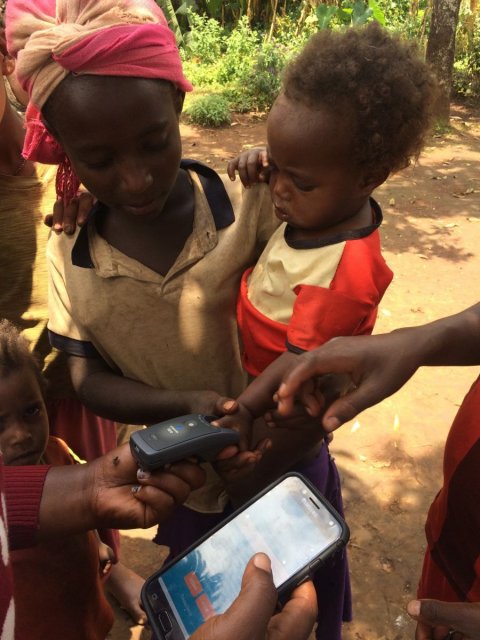 Taking finger prints to improve coverage and compliance of treatment. Image courtesy World Vision Ethiopia.