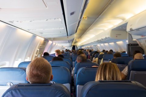Choose a window seat rather than an aisle seat