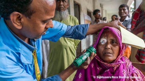 © Sightsavers/Reza Shahriar Rahman Caption: An eye hospital staff member performing a vision test at a free eye camp in Bangladesh.